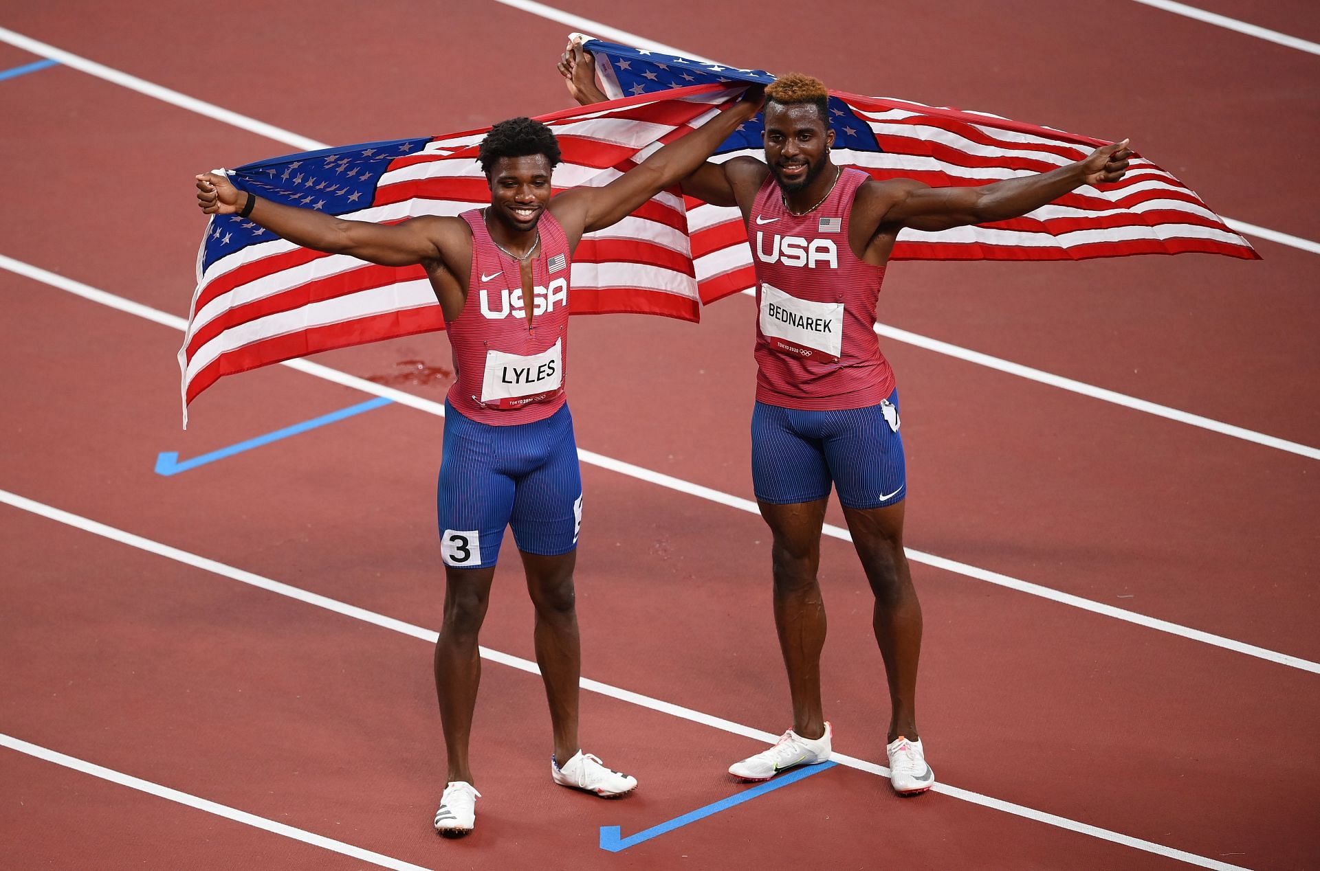 Noah Lyles (left) and Kenneth Bednarek (center) celebrate after the Men's 200m Final at the Tokyo 2020 Olympic Games. (Photo by Matthias Hangst/Getty Images)